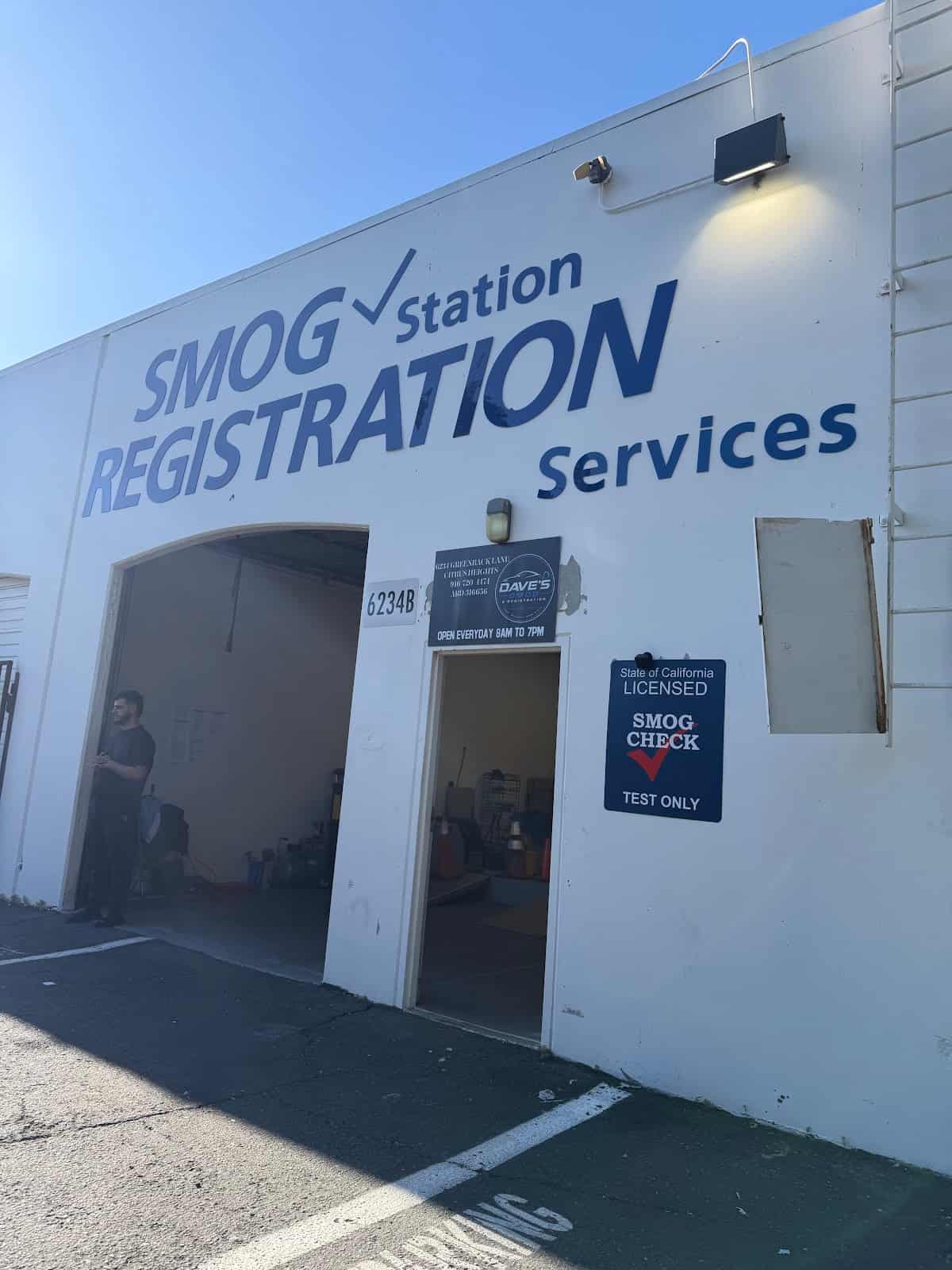 Shop entrance with the placard showing the address, phone number, and 8 AM to 7 PM hours, beside the STAR certified sign